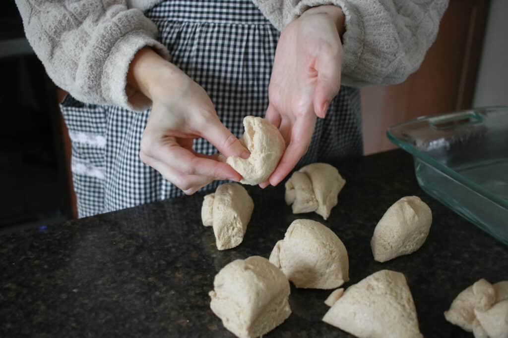 Woman rolling dinner rolls