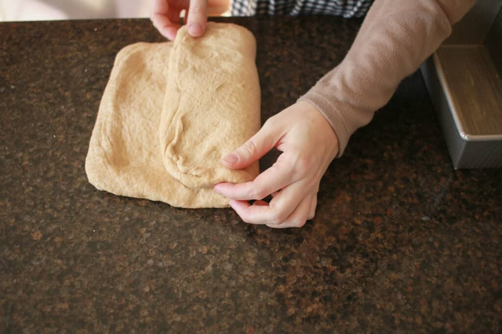 Woman folding dough